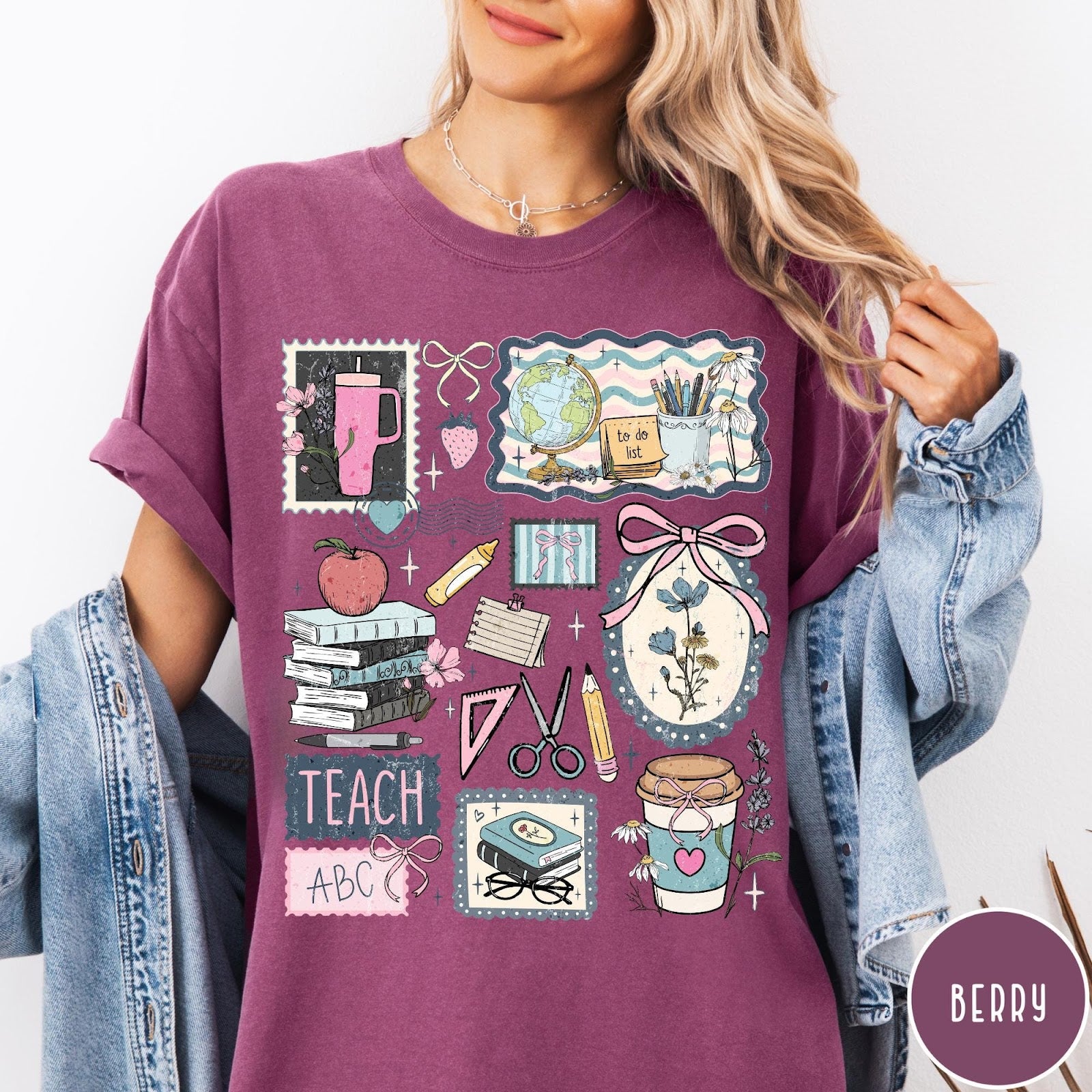 Comfort Colors tee in Berry featuring collage style graphic with school supplies, books, and teacher life elements