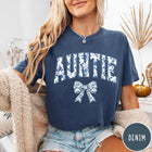 Comfort Colors tee in Denim featuring floral bow graphic with the word Auntie in blue floral print