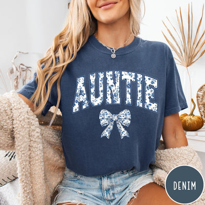 Comfort Colors tee in Denim featuring floral bow graphic with the word Auntie in blue floral print