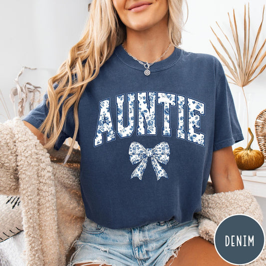 Comfort Colors tee in Denim featuring floral bow graphic with the word Auntie in blue floral print