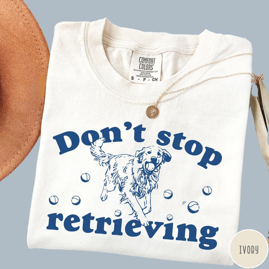 Comfort Colors tee in Ivory featuring screen print style graphic of a Golden Retriever with tennis balls