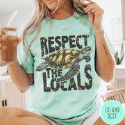 Comfort Colors tee in Island Reef featuring vintage style sea turtle graphic with Respect the Locals text