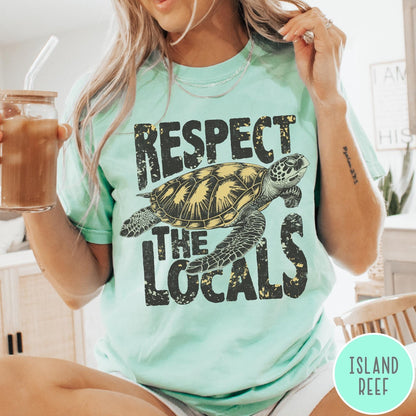 Comfort Colors tee in Island Reef featuring vintage style sea turtle graphic with Respect the Locals text
