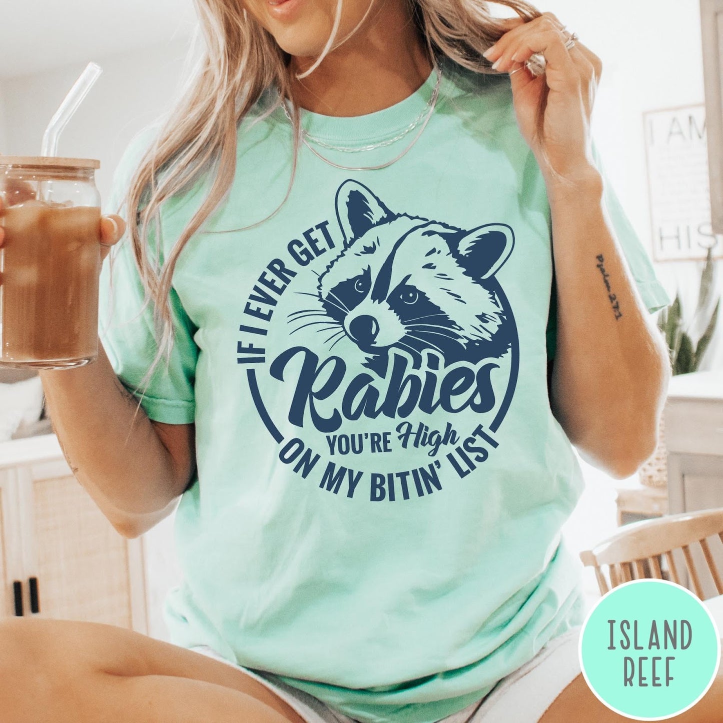 Comfort Colors tee in Island Reef featuring screen print style graphic of a raccoon with funny rabies text