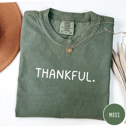 Comfort Colors tee in Moss featuring minimalist design with the word Thankful printed in white text