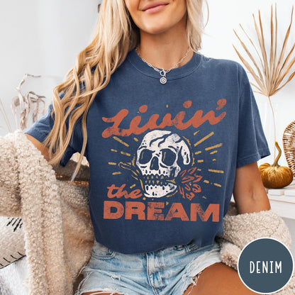 Comfort Colors tee in Denim featuring vintage style skull graphic with Livin the Dream text design