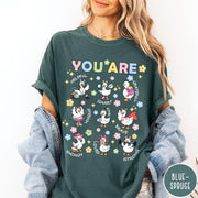 Comfort Colors tee in Blue Spruce featuring cute cartoon duck graphic with inspirational words like kind and brave