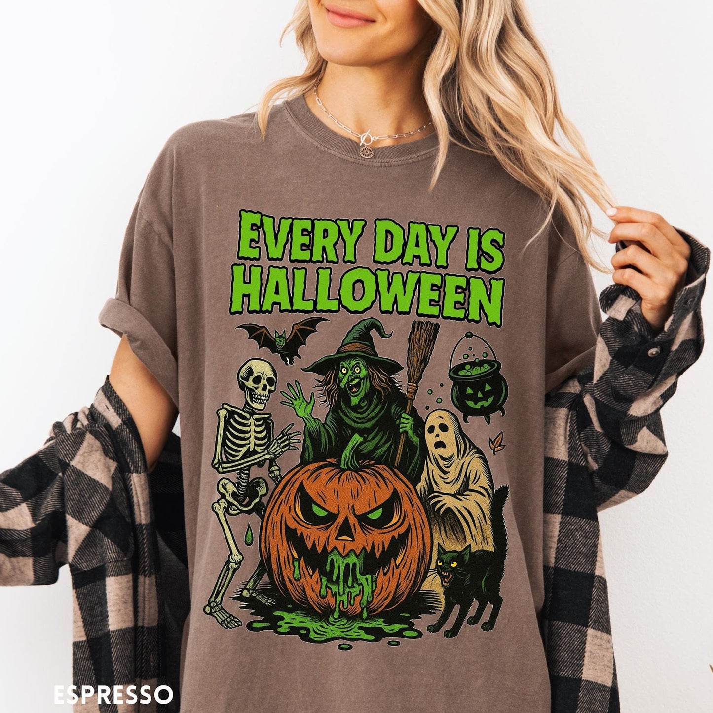 Comfort Colors tee in Espresso featuring Halloween graphic with a witch, skeleton, ghost, and a dripping pumpkin.