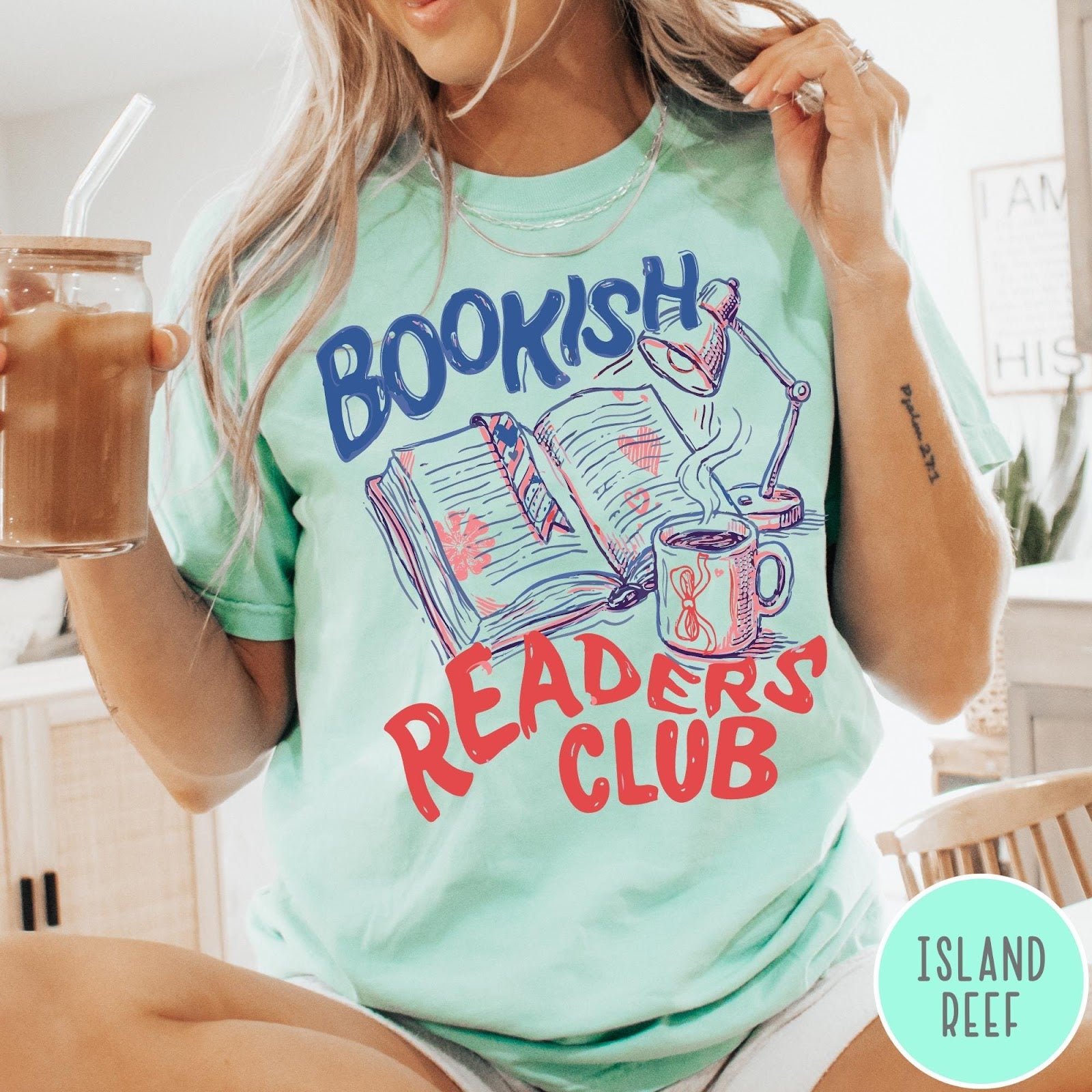 Comfort Colors tee in Island Reef featuring illustrated book graphic with a lamp and a coffee mug design
