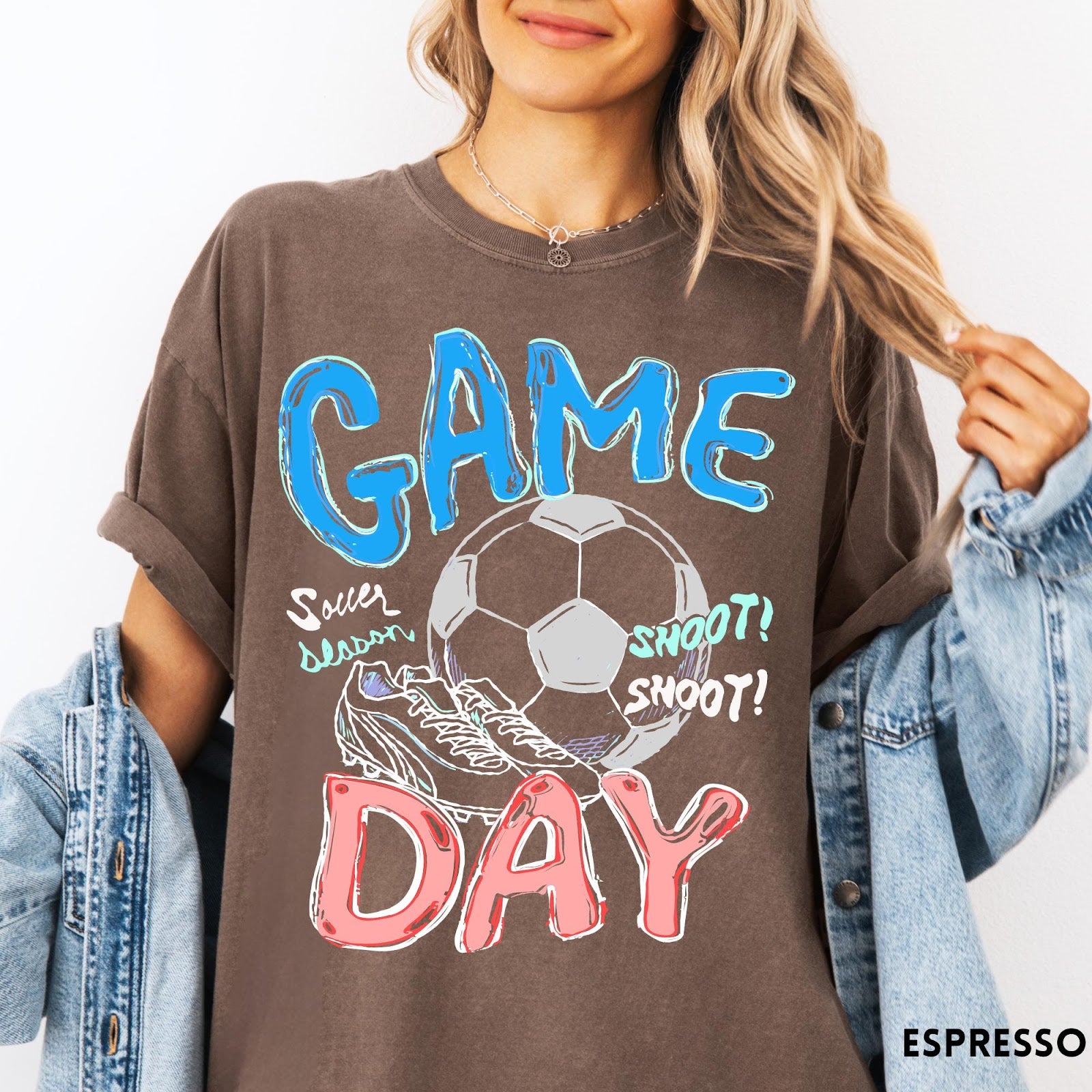 Comfort Colors tee in Espresso featuring soccer graphic with ball, cleats, and Game Day typography design