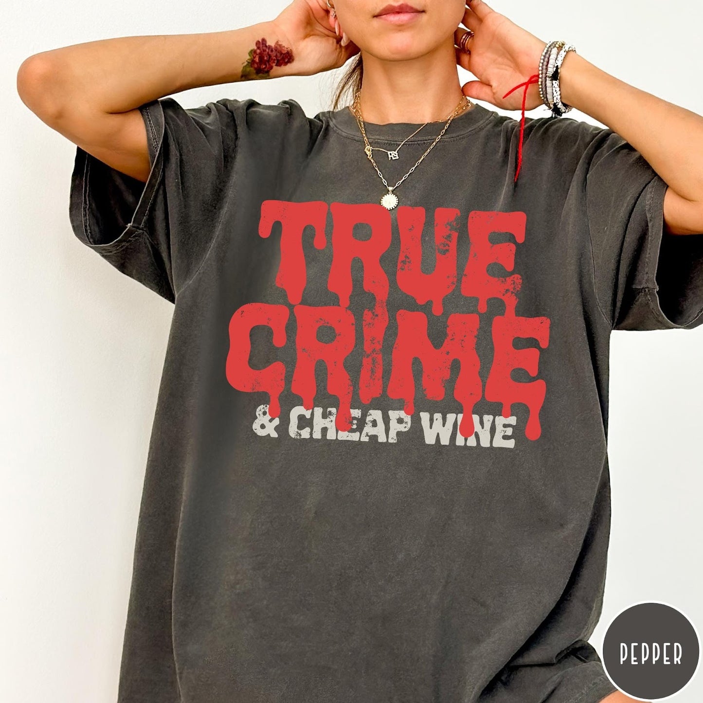 Comfort Colors tee in Pepper featuring red dripping text graphic that says True Crime and Cheap Wine