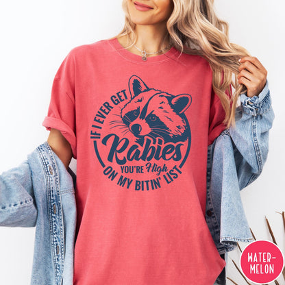 Comfort Colors tee in Watermelon featuring raccoon graphic with text If I Ever Get Rabies You're High On My Bitin' List