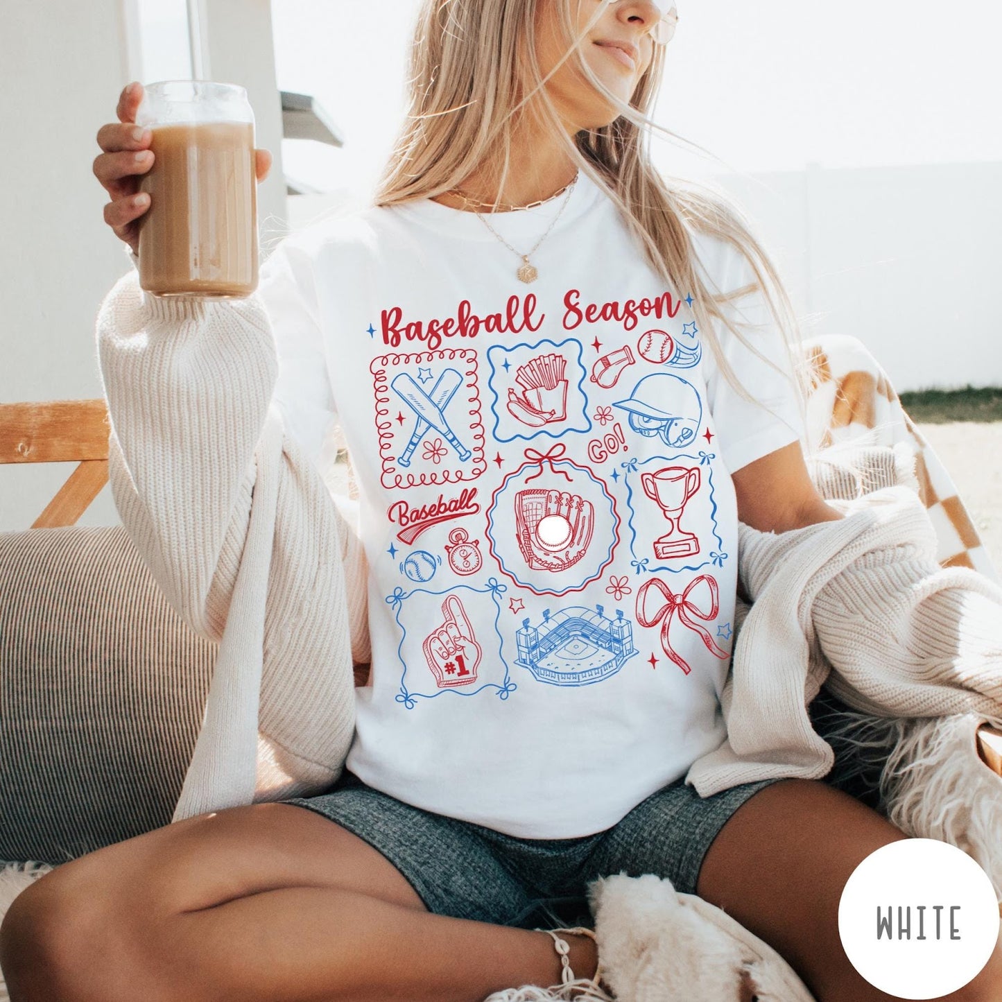 Comfort Colors tee in White featuring baseball icons including bats, a glove, stadium, and trophy graphic design