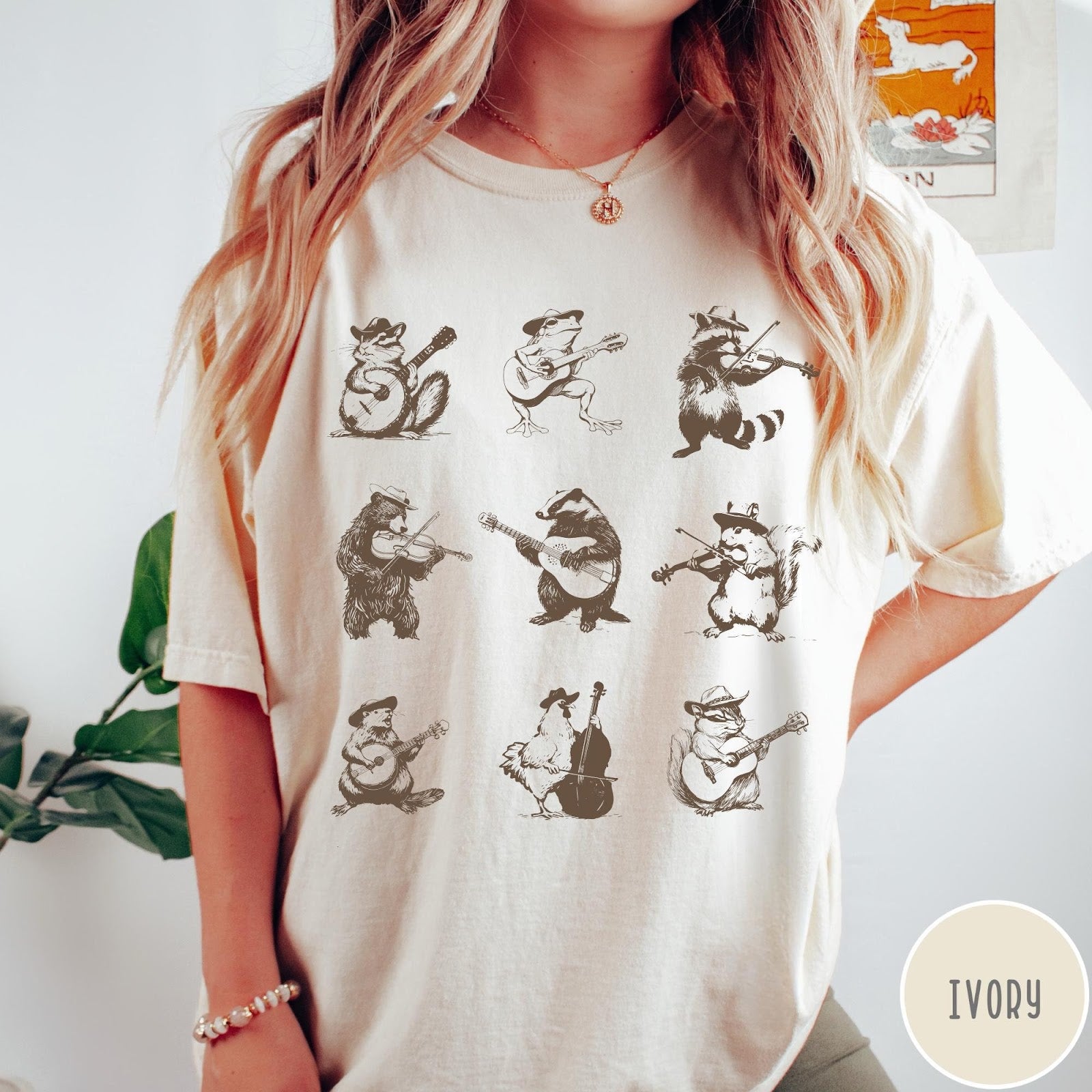 Comfort Colors tee in Ivory featuring vintage style graphic of various animals playing different musical instruments
