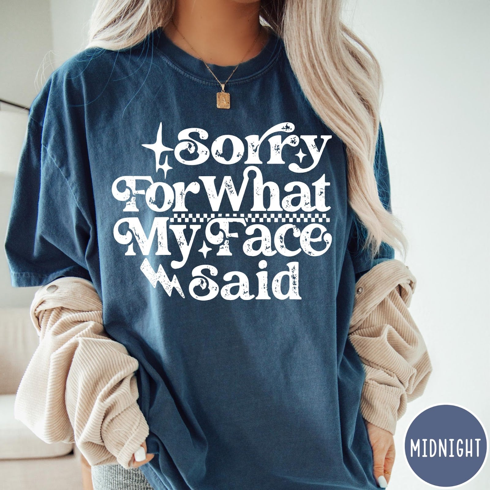 Comfort Colors tee in Midnight featuring sarcastic expression graphic Sorry for What My Face Said in white