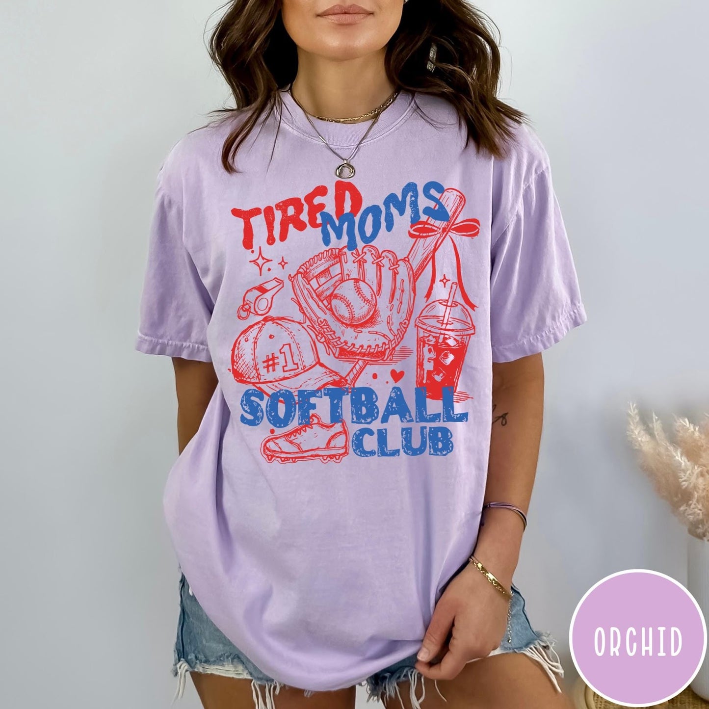 Comfort Colors tee in Orchid featuring softball mom life graphic with glove, ball, and iced coffee