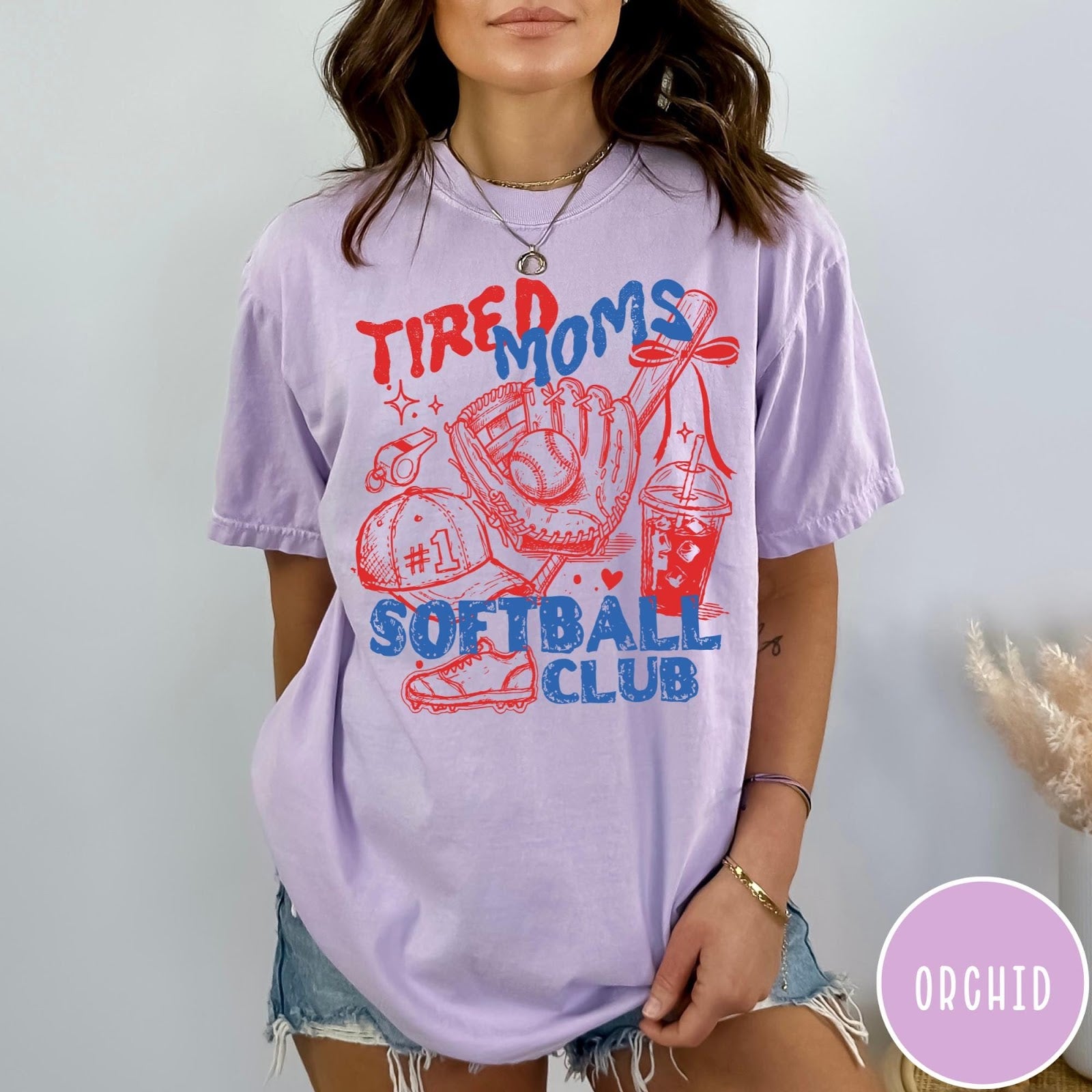 Comfort Colors tee in Orchid featuring softball mom life graphic with glove, ball, and iced coffee