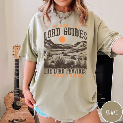 Comfort Colors tee in Khaki featuring desert landscape graphic with a rider and sun design.