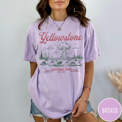 Comfort Colors tee in Orchid featuring retro graphic design of Yellowstone National Park with bison and geyser