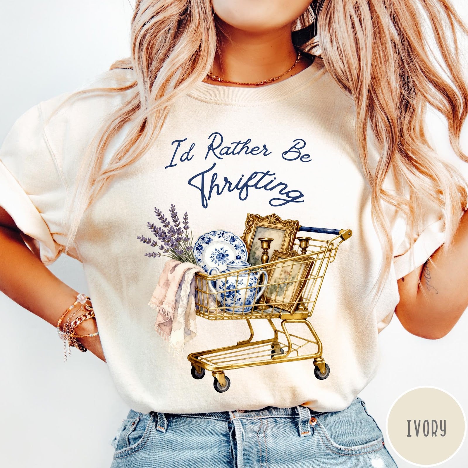 Comfort Colors tee in Ivory featuring vintage decor graphic of a shopping cart filled with thrifted items