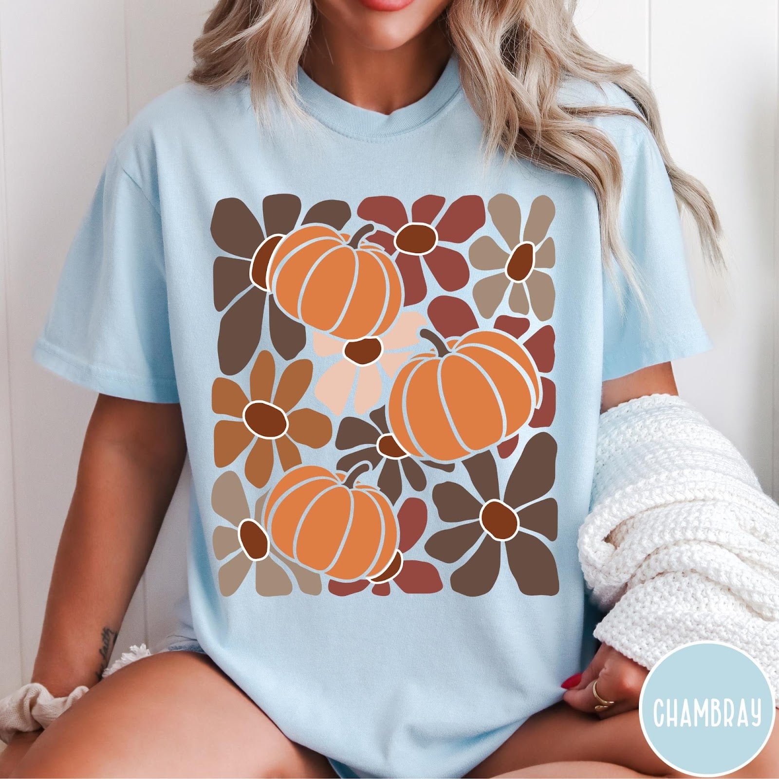 Comfort Colors tee in Chambray featuring boho floral style graphic with three orange pumpkins and brown flowers