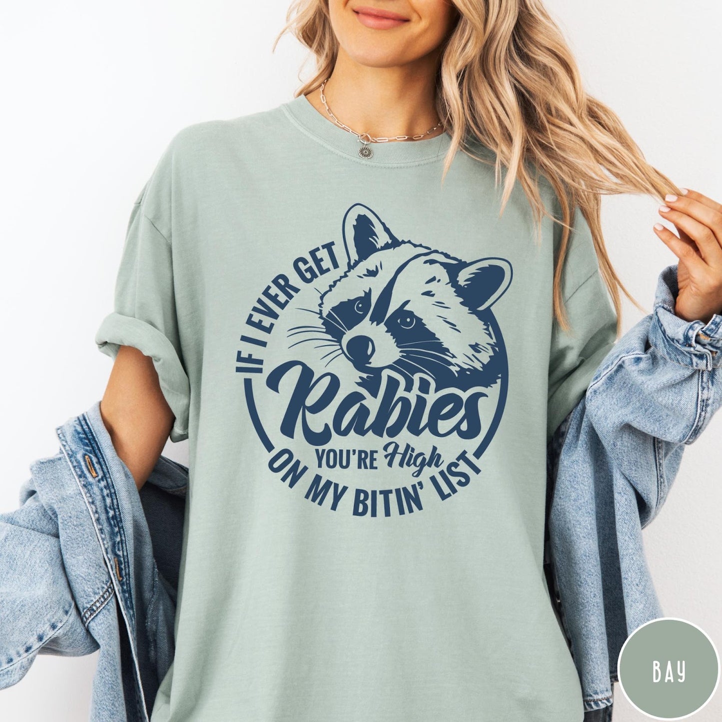 Comfort Colors tee in Bay featuring raccoon graphic with text If I Ever Get Rabies You're High On My Bitin' List