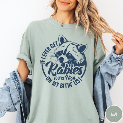 Comfort Colors tee in Bay featuring raccoon graphic with text If I Ever Get Rabies You're High On My Bitin' List