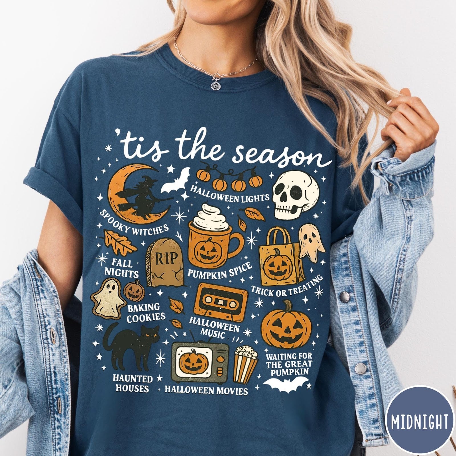 Comfort Colors tee in Midnight featuring Halloween icons collage with witch, skull, pumpkin, and spooky fall graphics