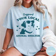 Comfort Colors tee in Chambray featuring graphic illustration of a dog wearing sunglasses and surrounding small hearts