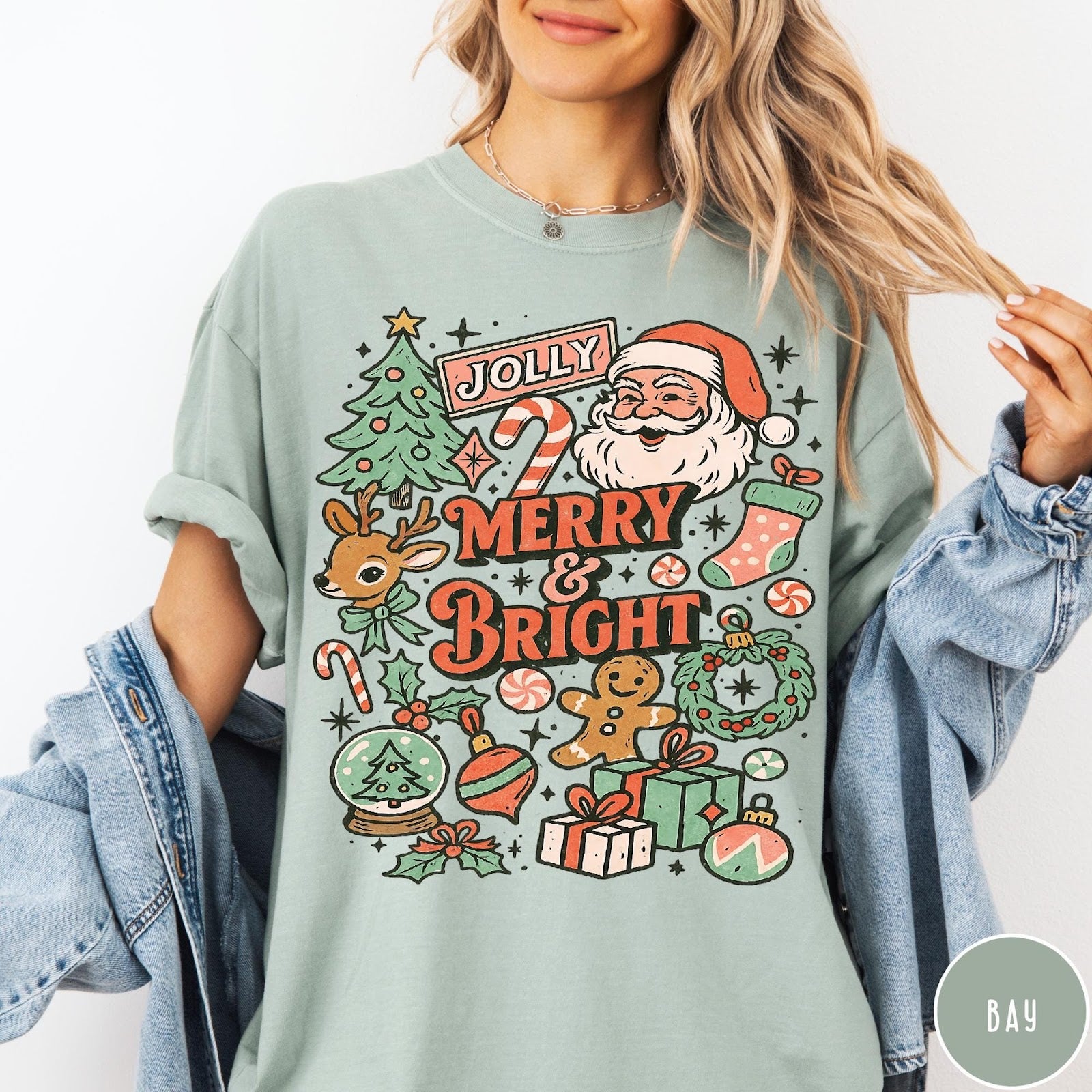 Comfort Colors tee in Bay featuring retro holiday style graphic with Santa, reindeer, and Christmas icons