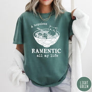 Comfort Colors tee in Light Green featuring line art graphic of a cute cat inside a ramen bowl