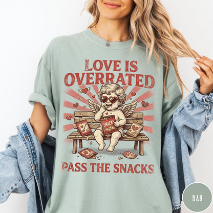 Comfort Colors tee in Bay featuring vintage style graphic of a cherub eating snacks on a bench