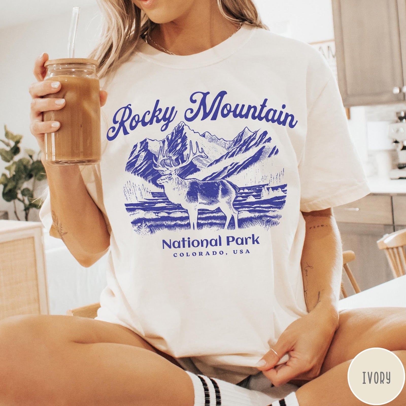 Comfort Colors tee in Ivory featuring vintage style graphic of an elk standing in front of mountains