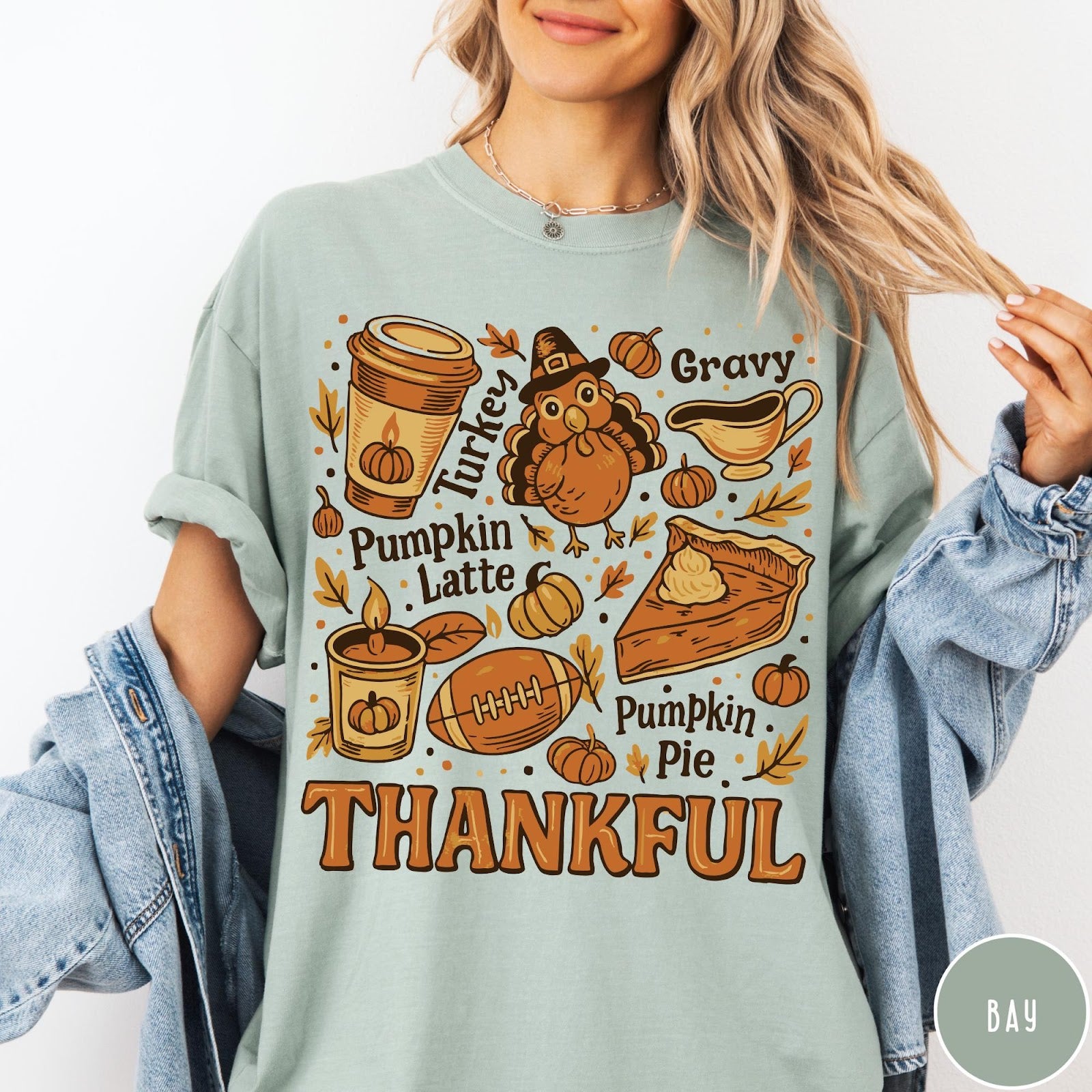 Comfort Colors tee in Bay featuring retro Thanksgiving dinner items including turkey, pumpkin latte, and pumpkin pie graphic