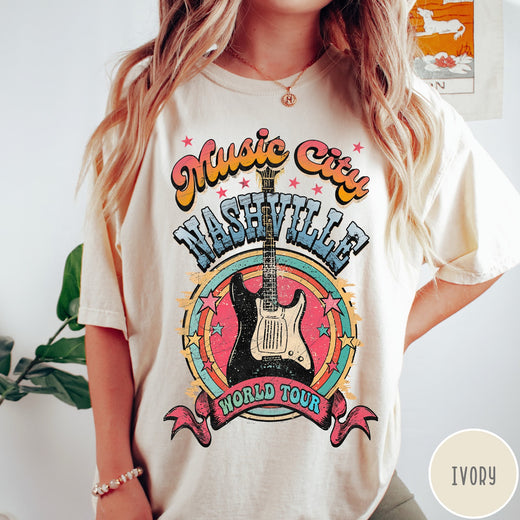 Comfort Colors tee in Ivory featuring retro style Nashville Music City guitar graphic with colorful circular design
