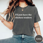Comfort Colors tee in Pepper featuring food style graphic text that reads I'll just have the chicken tenders