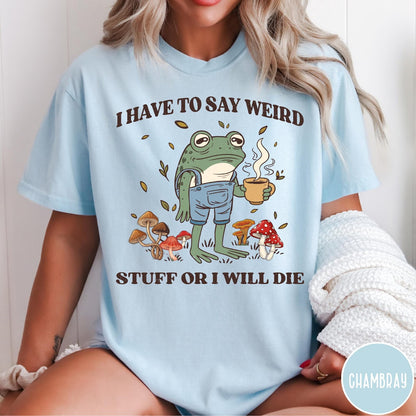 Comfort Colors tee in Chambray featuring illustrative frog graphic with coffee cup and various forest mushrooms