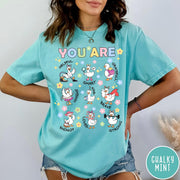Comfort Colors tee in Chalky Mint featuring cute cartoon duck graphic with inspirational words like kind and brave