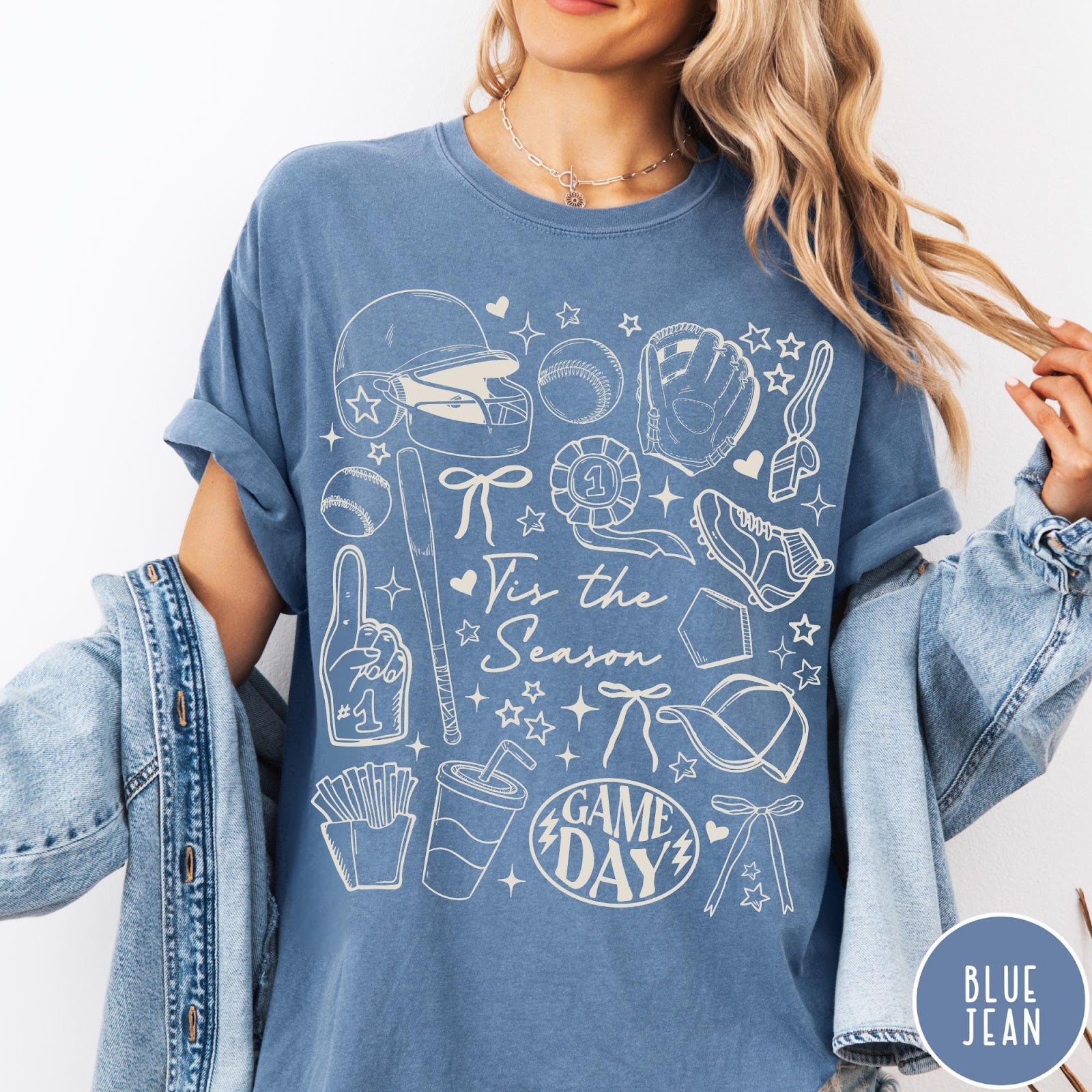 Comfort Colors tee in Blue Jean featuring baseball game day graphic with helmet, bat, ball, and snacks.