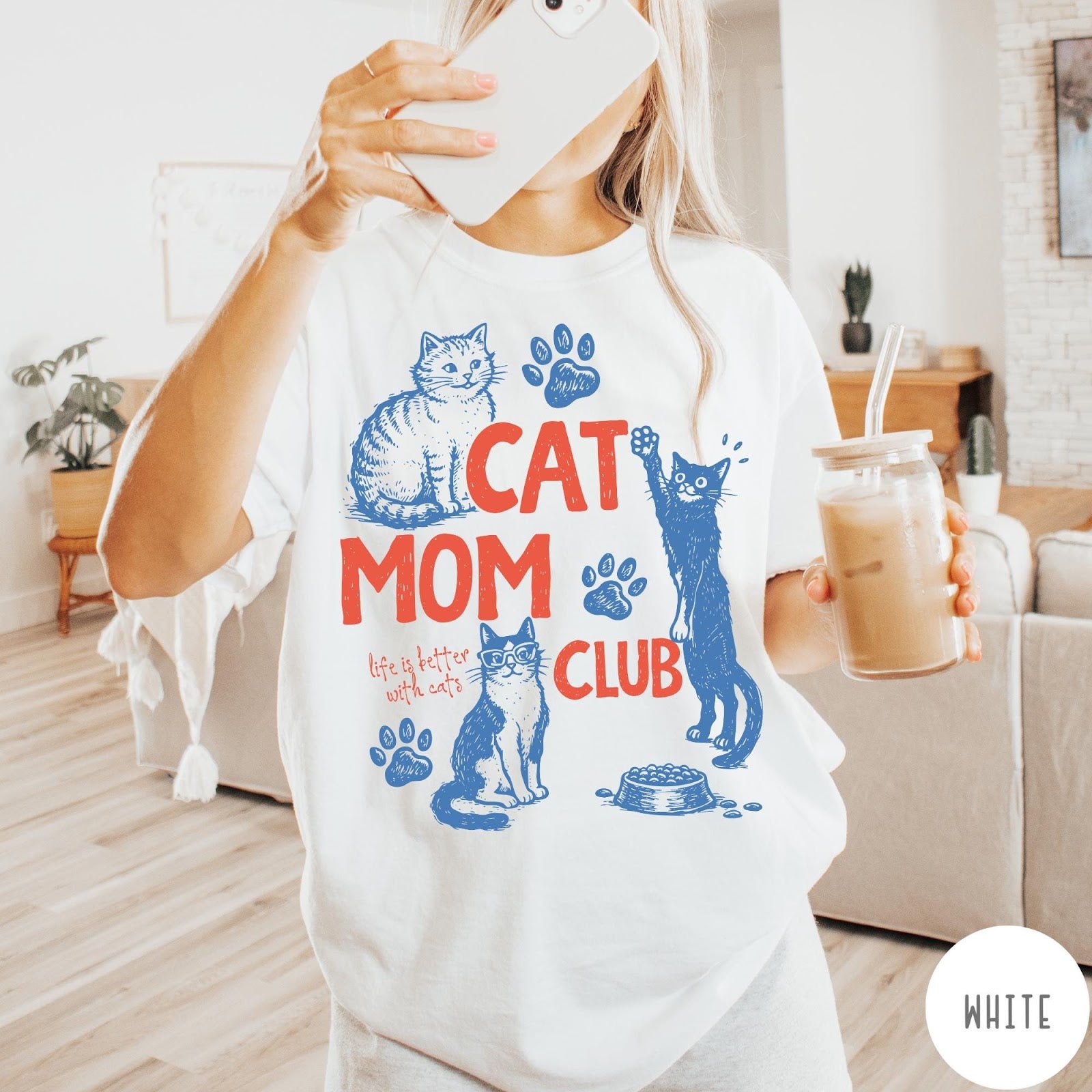 Comfort Colors tee in White featuring graphic illustration of cats, paw prints, and Cat Mom Club text