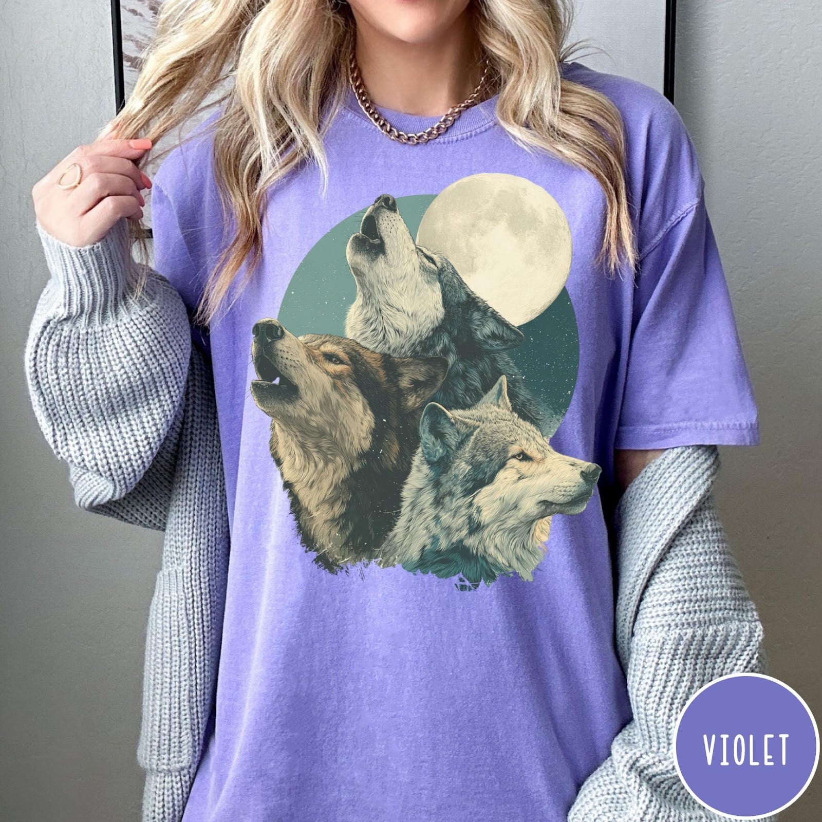 Comfort Colors tee in Violet featuring vintage style graphic of three wolves howling at a full moon
