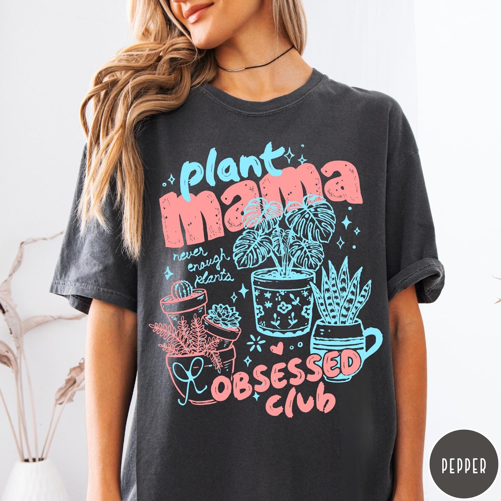 Comfort Colors tee in Pepper featuring graphic design with potted plants and Plant Mama Obsessed Club text