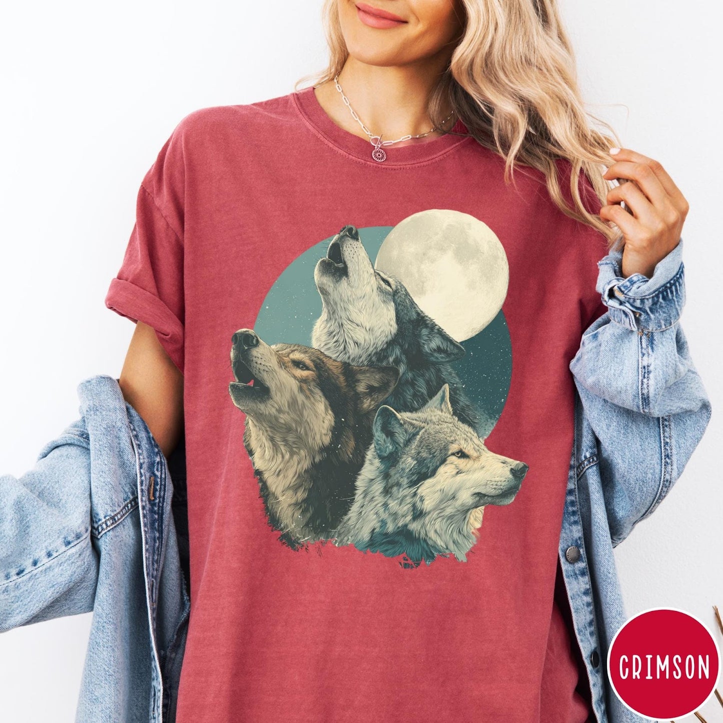 Comfort Colors tee in Crimson featuring vintage style graphic of three wolves howling at a full moon