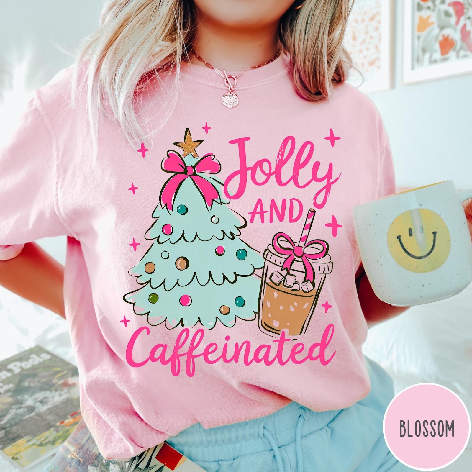 Comfort Colors tee in Blossom featuring festive holiday style with a Christmas tree and iced coffee graphic