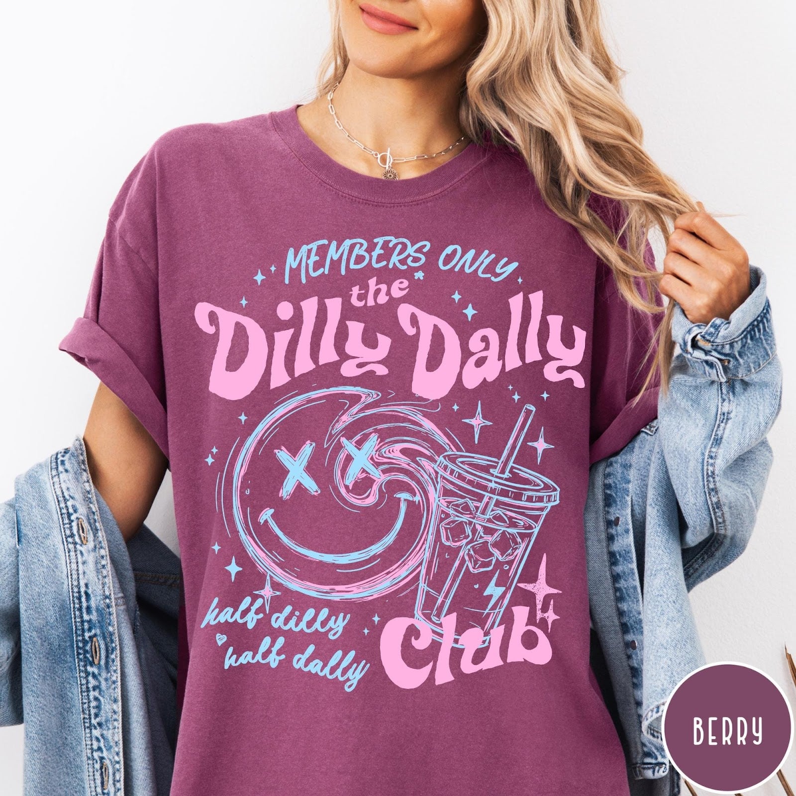 Comfort Colors tee in Berry featuring Dilly Dally Club graphic with smiley face and iced coffee cup