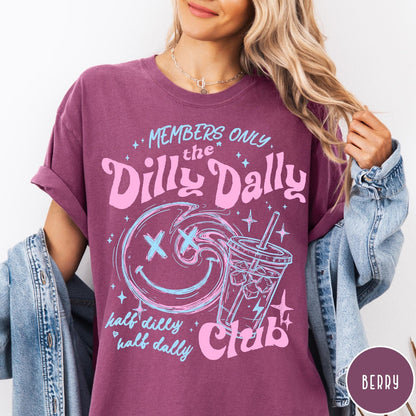 Comfort Colors tee in Berry featuring Dilly Dally Club graphic with smiley face and iced coffee cup