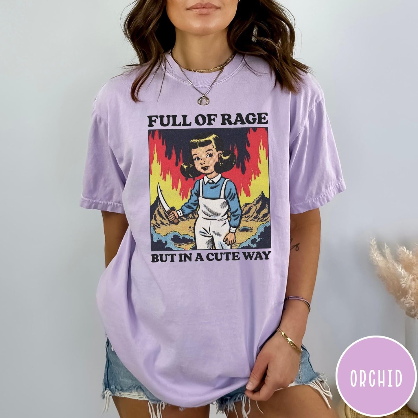 Comfort Colors tee in Orchid featuring cartoon style graphic of a girl holding a knife in flames