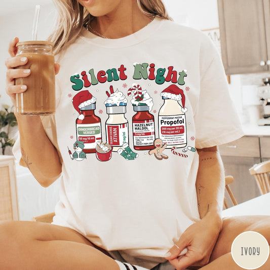 Comfort Colors tee in Ivory featuring holiday graphic with medical vials styled as festive holiday treats