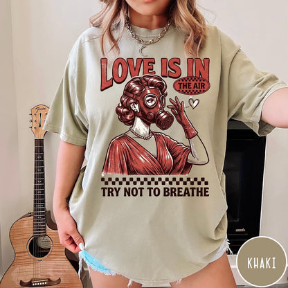 Comfort Colors tee in Khaki featuring retro graphic design of a woman wearing a gas mask