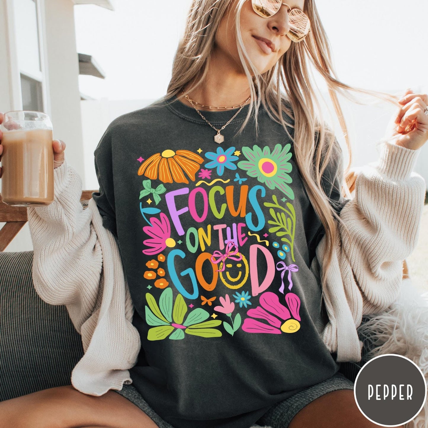 Comfort Colors tee in Pepper featuring positivity typography and floral collage graphic with a smiley face.
